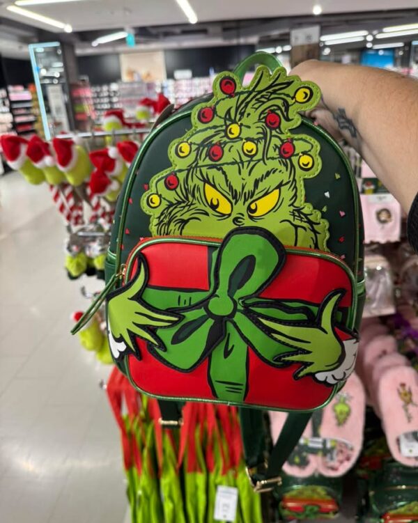 LOVE this Grinch bag at Primark! Only £15 and looks just like an expensive loungefly…